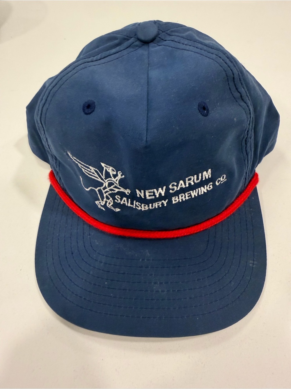 New Sarum Salisbury Brewing Co. Navy Hat with Red Rope Accent